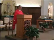  ?? RICHARD PAYERCHIN — THE MORNING JOURNAL ?? The Rev. Daniel Divis speaks during the morning Mass at St. Mary’s Church, 309 W. Seventh St., Lorain.