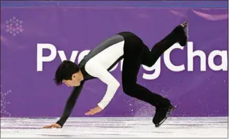  ?? [PHOTOS BY DAVID J. PHILLIP/THE ASSOCIATED PRESS] ?? Nathan Chen of the United States falls while performing during the men’s short program in the Gangneung Ice Arena at the Winter Olympics Friday in Gangneung, South Korea.