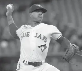  ?? FRED THORNHILL, THE CANADIAN PRESS ?? Blue Jays starting pitcher Marcus Stroman throws against the Boston Red Sox in their American League baseball game in Toronto on Tuesday night. The loss by the Blue Jays dropped their record for the campaign to 2-11. Stroman lasted just 4 2/3 innings,...