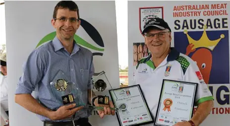  ??  ?? SUPER SAUSAGES: Celebratin­g their success is owner and butcher of Westridge Meats and The Ridge Meats Luke Jensen (left) with Australian Meat Industry Council regional manager Rob Mollison.