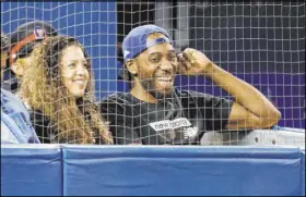  ?? Mark Blinch The Associated Press ?? Two-time NBA Finals MVP Kawhi Leonard of the newly crowned champion Raptors, with girlfriend Kishele Shipley at a Toronto Blue Jays game on Thursday, is probably the biggest mystery that needs solving entering this year’s free agency period.