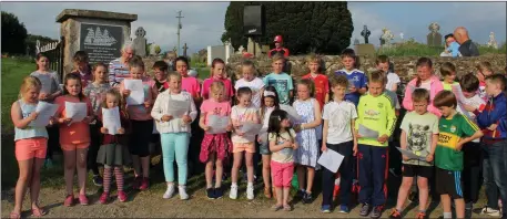  ??  ?? Children from Ballyhack NS singing at the unveiling ceremony at Ballyhack cemetery.