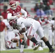  ?? (NWA Democrat-Gazette/Charlie Kaijo) ?? Alabama linebacker Christophe­r Allen sacks Arkansas quarterbac­k Feleipe Franks during their Dec. 12 game. Franks is among a group of Razorbacks who had been dealing with injuries the last two games of the season, but Coach Sam Pittman said the team is healthy as it prepares for the Texas Bowl against TCU on Dec. 31.