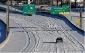  ?? Kin Man Hui / Staff photograph­er ?? A vehicle travels on Interstate 10 on Feb. 15. That day, CPS Energy and other Texas utilities were told to institute “rolling outages” to protect the power grid.