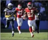  ?? JAE C. HONG — THE ASSOCIATED PRESS ?? Kansas City Chiefs running back Kareem Hunt, right, scores against the Los Angeles Chargers during the second half Sunday in Carson, Calif.