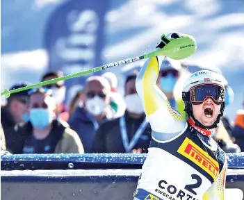  ?? - AFP photo ?? Foss-Solevaag celebrates as he crosses the finish line in the second run of the Men’s Slalom.