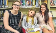  ?? SUBMITTED PHOTO ?? Tutor Ellie Beck, left, student Shaylyne Carver, and Ready, Set, Learn! coordinato­r Gina Hyson review the Summer Tutoring Program for Kids, which ended in late August. The P.E.I. Literacy Alliance hosted the summer tutoring program in 21 public libraries across the province.