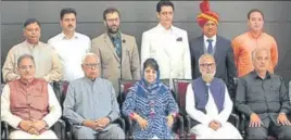  ??  ?? J&K governor NN Vohra (2nd L), CM Mehbooba Mufti (C), PDP senior leader Naeem Akthar (2nd R), AR Veeri (1st R), newly inducted deputy CM Kavinder Gupta (1st L) and minister of state Sat Sharma standing behind (1st L), Mir Zahoor Ahmad MLA Pampore (2nd...