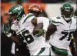  ?? GARY LANDERS - THE ASSOCIATED PRESS ?? New York Jets running back Le’Veon Bell (26) runs the ball against Cincinnati Bengals linebacker Germaine Pratt, center, during the first half of an NFL football game, Sunday, Dec. 1, 2019, in Cincinnati.