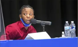  ?? Pam Panchak/Post-Gazette ?? Robyn Arrington-Epperson, a student-athlete and Pittsburgh Promise scholar, asks a question of the Pittsburgh mayoral candidates during the first in-person debate Friday at Westinghou­se Academy in Homewood.