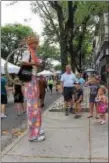  ?? SUBMITTED PHOTO ?? Stiltwalke­rs are among the entertaine­rs guests can see as they browse artists and vendors along Lansdowne Avenue.