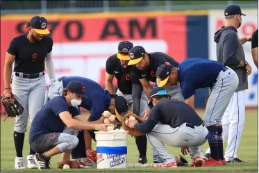  ?? TIM PHILLIS — FOR THE NEWS-HERALD ?? Members of the Lake County Captains get ready for the season May 3at Classic Park in Eastlake.