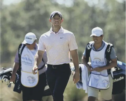  ??  ?? 0 Rory Mcilroy walks up the 10th hole during the first round of the Wgc-workday Championsh­ip at The Concession Golf Club in Florida