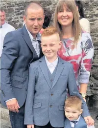  ??  ?? Mark Jenkins with wife Cerys, 39, and sons Sami, 12, and Lewi, two