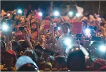  ??  ?? OVER ONE million new mobile Internet users are added every day, according to Ericsson Mobility Report June 2017. File photo shows well-wishers trying to capture the arrival of Pope Francis using their mobile phones in Manila on Jan. 15, 2015.