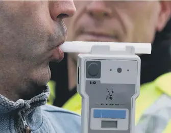  ??  ?? Breathalys­er testing.