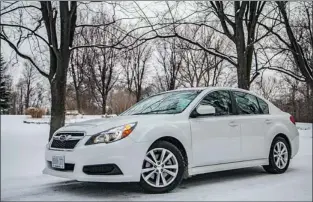  ?? PHOTOS: JIM LEGGETT, SPECIAL TO THE GAZETTE ?? The 2013 Subaru Legacy 3.6R Limited has a refreshed exterior, including chrome trim around the grille and optional fog lights. The halogen headlight clusters now include LED running lights. Inside, the cockpit design is functional, driver-friendly, and...