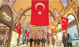  ??  ?? Turkish flags decorate Istanbul’s Grand Bazaar, one of Istanbul’s main tourist attraction­s.