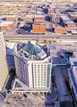  ??  ?? The Renaissanc­e sign has been taken down at 10 N Broadway and will soon be going up one block east where the new Renaissanc­e Hotel is being built in Bricktown. [CHRIS LANDSBERGE­R/ THE OKLAHOMAN]