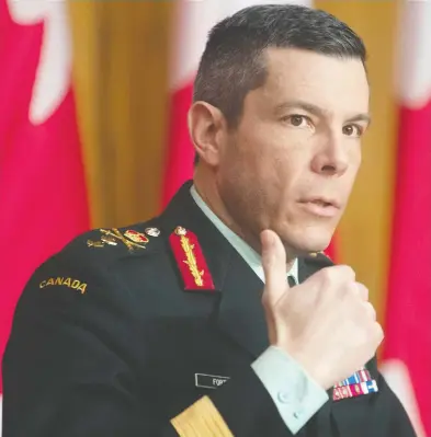  ?? ADRIAN WYLD / THE CANADIAN PRESS ?? Maj.-Gen. Dany Fortin responds to questions on COVID vaccines on Thursday in Ottawa, saying efforts are underway to make sure supplies and storage needs are identified so all is in place when the bigger shipments started arriving.