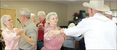  ?? LYNN KUTTER ENTERPRISE-LEADER ?? Music and dancing are popular at Farmington Senior Activity and Wellness Center and these couples enjoy a few turns around the floor. Margaret Moore and Dale Horton are to the left and Jewel and Clydesdale Barnett dance together in the foreground. At...