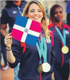  ??  ?? “La Princesa del Karate” exhibe con orgullo la bandera tricolor, la que ha levantado en grandes eventos.