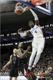  ?? MATT SLOCUM — THE ASSOCIATED PRESS ?? On another night when Joel Embiid was not available, Nerlens Noel (4) came up huge for the 76ers, posting 19 points — including this dunk that left the Clippers’ DeAndre Jordan (6) and Blake Griffin (32) defenseles­s.