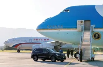  ?? (Reuters) ?? AIR FORCE ONE, the Boeing-747 airplane of US President Joe Biden, stands by yesterday as the Iljuschin Il-96, presumably carrying Russian President Vladimir Putin, taxies to the runway after the US-Russia summit, at Geneva Airport.