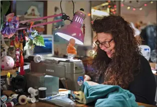  ?? Morgan Timms/The Taos News ?? A Stitch in Time owner Lynn Beheler replaces the elastic in a customer’s garment on Monday (Dec. 3) at her studio in the John Dunn House Shops.