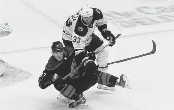  ?? CHRIS YOUNG AP ?? Carolina Hurricanes’ Andrei Svechnikov (37) is taken down by Boston Bruins’ Zdeno Chara (33) during third period NHL Eastern Conference Stanley Cup playoff game in Toronto on Saturday, Aug. 15, 2020.