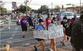  ?? Steve Gonzales / Staff photograph­er ?? Protesters march against evictions last month in Houston. A CDC order stops residentia­l evictions of the most vulnerable through the end of 2020.