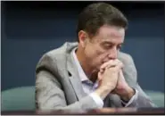  ?? ALTON STRUPP — THE COURIER-JOURNAL VIA AP, FILE ?? In this June 15 file photo, Louisville basketball coach Rick Pitino listens during an NCAA college basketball news conference in Louisville, Ky.