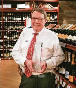  ?? ?? George Punter, wine manager for Dorothy Lane Market in Centervill­e.