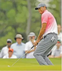  ?? CHUCK BURTON/THE ASSOCIATED PRESS ?? Tiger Woods reacts to missing a putt on the fourth hole Saturday at the Wells Fargo Championsh­ip in Charlotte, N.C. He says he is close to return to his old form.
