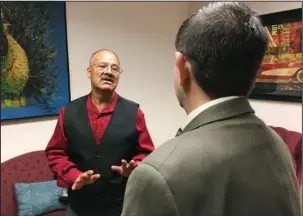  ?? The Associated Press ?? INSULIN PRICES: Jacobo Perez-Jimenez, left, a Las Vegas cook, talks with Democratic state Sen. Mark Manendo about his increasing insulin costs on April 19 at the Nevada Legislatur­e building in Carson City, Nev. Perez-Jimenez is a member of a union that...