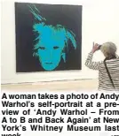  ??  ?? A woman takes a photo of Andy Warhol’s self-portrait at a preview of ‘Andy Warhol – From A to B and Back Again’ at New York’s Whitney Museum last week. AFP