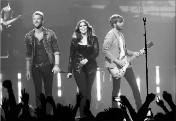  ??  ?? Lady Antebellum Kelley, Scott and Haywood (left to right) perform as part of Rebuilding Henryville With Lady Antebellum at the YUM Centre on May 16, 2012 in Louisville, Kentucky. — AFP file photo