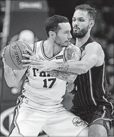  ?? [LAURENCE KESTERSON/THE ASSOCIATED PRESS] ?? Philadelph­ia’s JJ Redick looks to maneuver against the defense of Orlando’s Evan Fournier Saturday’s game.