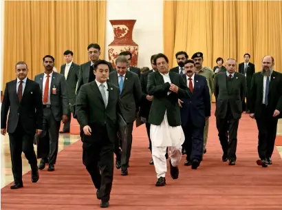  ?? AFP ?? Prime Minister Imran Khan, accompanie­d by his delegation, arrives to meet Chinese President Xi Jinping (not pictured) at the Great Hall of the People in Beijing on Friday.—