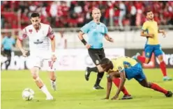  ?? ?? ↑
Players of Wydad Casablanca and Petro Luanda during their CAF Champions League match on Friday.