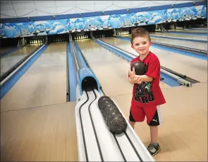  ?? Ernest A. Brown/The Call ?? Jaxson LeBeau, 4, of Seekonk, enjoys an afternoon of duckpin bowling with his family at The Bowling Academy Friday. The longtime, family-friendly bowling center is permanentl­y closing today.