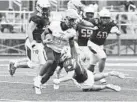  ?? PAUL W. GILLESPIE/CAPITAL GAZETTE ?? Loyola’s Micah Robinson looks to run in the second quarter. The visiting Loyola Blakefield Dons defeated St. Mary’s Saints, 7-6, in high school football Saturday.