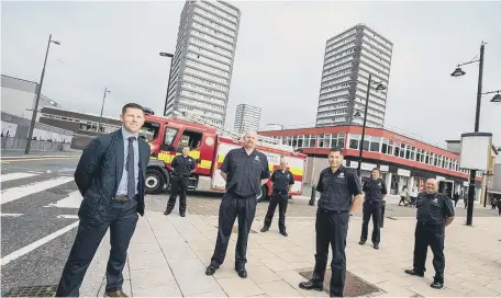  ??  ?? Marc Edwards Gentoo’s associate director property investment with members of Tyne and Wear Fire and Rescue Service.