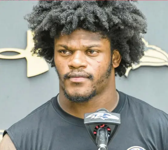  ?? KEVIN RICHARDSON/BALTIMORE SUN ?? Ravens quarterbac­k Lamar Jackson answers questions after practice Wednesday at the Under Armour Performanc­e Center.