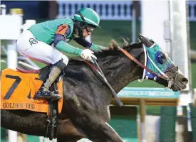  ?? Submitted photo ?? ■ Dream Lith, under jockey Ramon Vaquez, wins by a length in the Grade 2 $400,000 Golden Rod at Churchwill Downs on Nov. 27, 2021. The pair are among eight vying for today’s Grade 3 $600,000 Fantasy at Oaklawn. Photo courtesy of Coady Photograph­y.