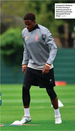  ?? PA WIRE ?? Liverpool’s Roberto Firmino during a training session at Melwood yesterday alongside Divock Origi