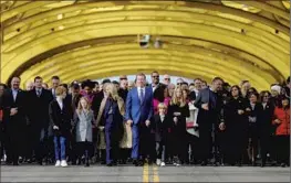  ?? Gary Coronado Los Angeles Times ?? GOV. GAVIN NEWSOM and his family lead the People’s March across Sacramento’s Tower Bridge ahead of the inaugurati­on ceremony for his second term.