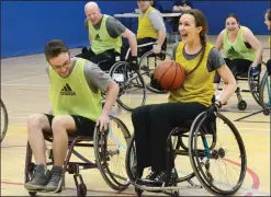  ?? NEWS PHOTO RYAN MCCRACKEN ?? Excel Physical Therapy's Stephanie Toews (right) drives to the basket while Adapt Mobility's Chase Duguay defends during the March Madness Wheelchair Baskteball tournament on Saturday at the Family Leisure Centre.