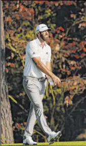  ?? David J. Phillip The Associated Press ?? Dustin Johnson played the first four holes in 4 under and finished with a 65 to match the 54-hole record low for the Masters.