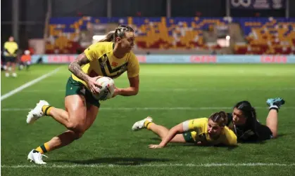  ?? Photograph: Charlotte Tattersall/Getty Images for RLWC ?? Julia Robinson of Australia crosses for Australia’s winning try in the Women's Rugby League World Cup Group B match against New Zealand Women at LNER Community Stadium.